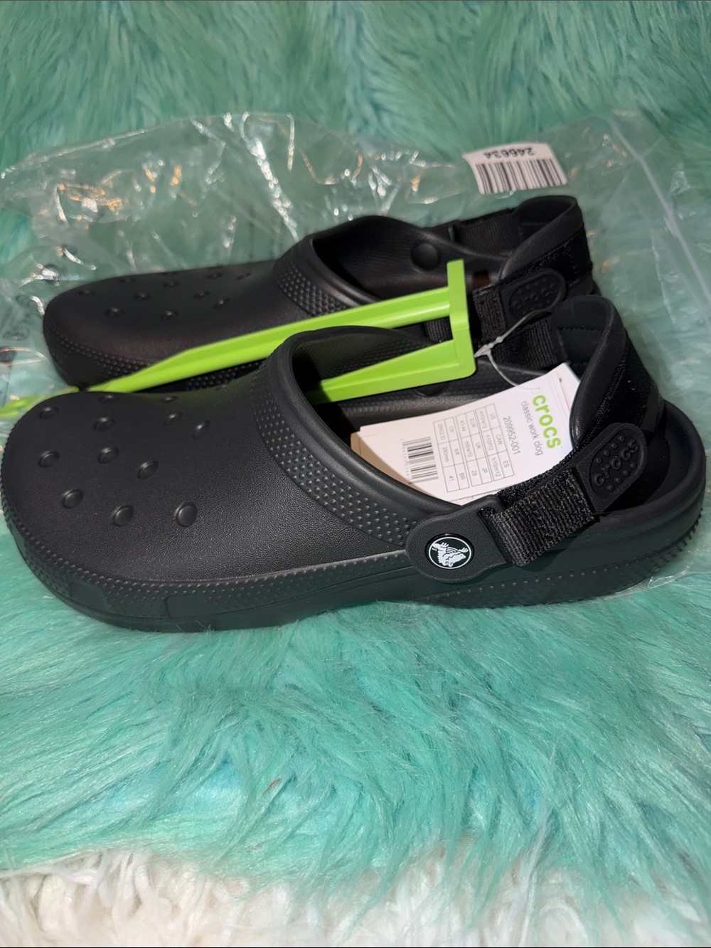 New in package Crocs Black Mens 10/ Women’s 12